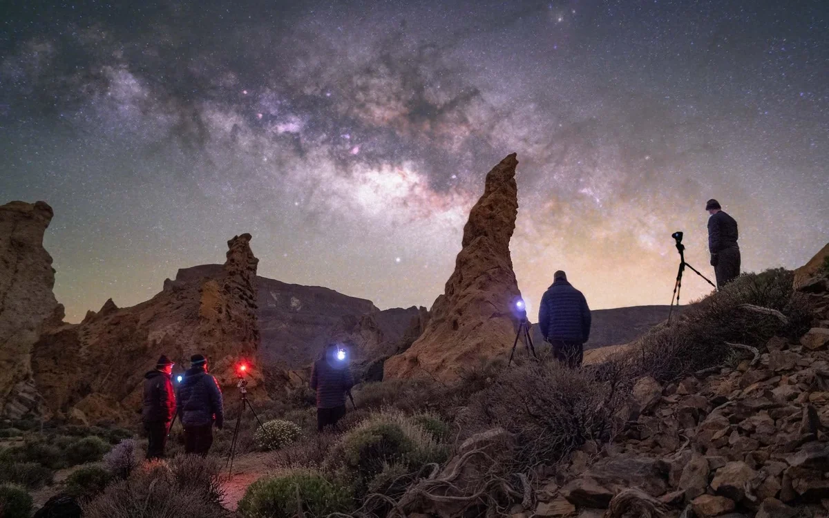 The Milky Way arching over the volcanic rocks of Teide National Park at night