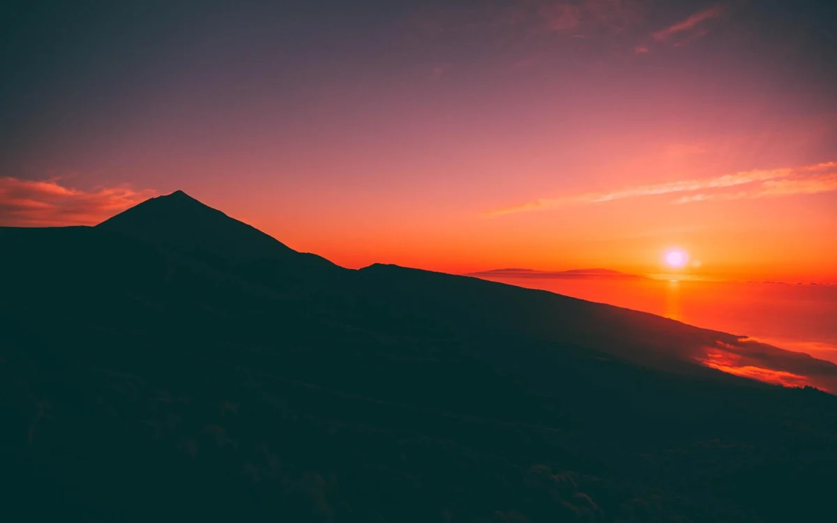 The sun going down over a sea of cloud from high on the slopes of Mount Teide